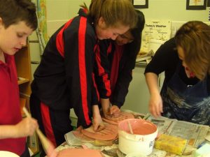 Hand Print Project in process. Large-scale Collaborative Public Art Commission 2009 with St. Peter’s National School, Phibsborough, Dublin. This project celebrated the opening of their new school building and had a strong collaborative element between Ceramic Artist Michelle Maher and the whole school community. We took the handprints in clay and slip of all pupils, teachers and staff and created a series of three large-scale ceramic wall murals. www.ceramicforms.com